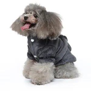 Side view detail of a grey poodle wearing a plush dark grey pet bathrobe with buttons