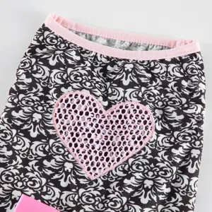 Cute black and white pet dog dress with pink heart mesh applique and comfortable collar trim.