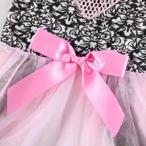 Close-up detail of pet summer dress featuring pink satin bow and soft mesh skirt layer.