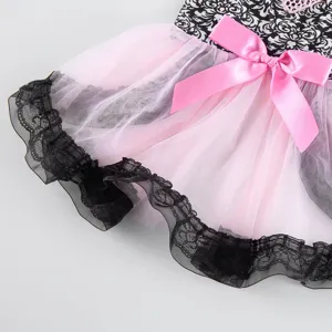 Detailed view of cute pet puppy dog summer dress with pink lace tulle and elegant bowknot.