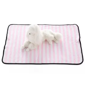Close-up detail of the pink and white striped pet blanket with a cute plush dog toy displayed.