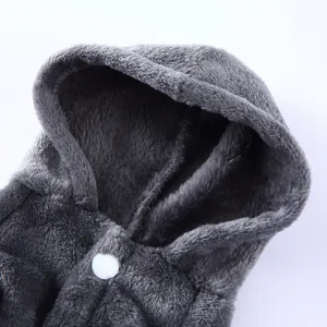 Close-up view of a grey fluffy fleece pet bathrobe featuring a soft hood and a white snap button.
