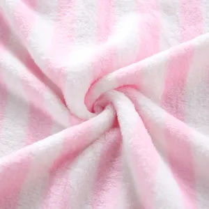 Close-up detail of soft pink and white striped plush fabric showing fluffy fleece texture.