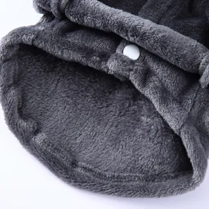 Macro detail of soft grey plush pet bathrobe showing texture and white snap button