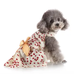 Cute pet dog dress with red heart pattern and elegant gold bow for summer daily wear.