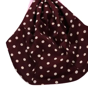 Detailed view of burgundy white polka dot pet sling bag breathable outdoor puppy carrier.