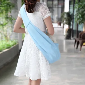 Detail view of a breathable light blue pet sling bag for outdoor travel and small dogs.