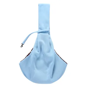 Light blue pet sling carrier detail, breathable cross-body puppy bag for daily outdoor walking.