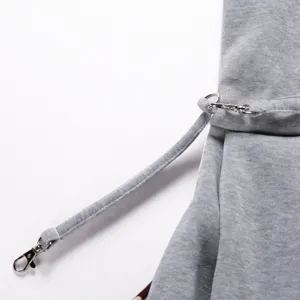 Detailed view of grey pet bag strap with metal lobster clasps and rings, durable.