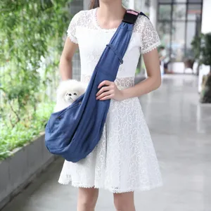 Breathable denim pet carrier sling bag for small dogs and cats outdoor travel portable design.