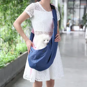 Pet sling carrier bag detail, breathable design, comfortable shoulder strap for pets.