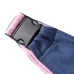 Close-up detail of adjustable strap and plastic buckle on pet carrier sling backpack.