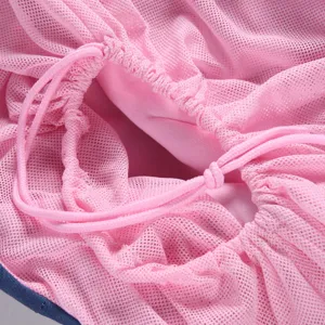 Detailed view of pink breathable mesh pet carrier drawstring bag, high quality pet accessory.