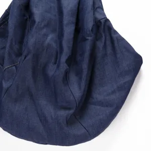 Detail view of the dark blue single shoulder pet sling bag, showing soft breathable fabric.