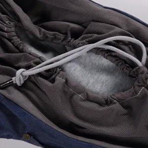 Close-up detail of breathable mesh lining and drawstring for pet carrier bag interior.
