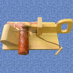 Manual oak sausage guillotine slicer with stainless steel blade cutting meat slices
