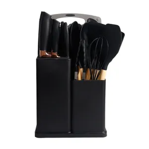 Kitchen silicone utensil set detail showing black spatulas knives and holder stand features.