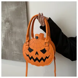 Fun pumpkin shaped handbag with jack-o'-lantern face and spider web print for Halloween