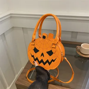 Quirky orange pumpkin shaped handbag with spider web design for Halloween