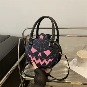 Quirky black and pink pumpkin-shaped handbag with spiderweb design for Halloween