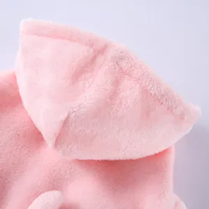 Macro detail of the soft pink plush fabric used in this cozy hooded pet bathrobe