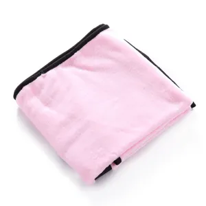 Detail view of the soft pink pet fleece blanket with paw print and black border for cats dogs.