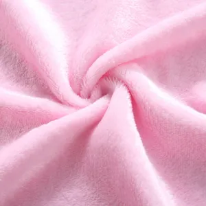 Soft pink fleece blanket fabric close up texture detail, cozy plush material macro view