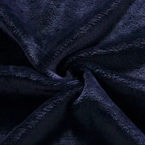 Detailed view of soft dark navy blue fleece pet blanket fabric texture close-up detail.