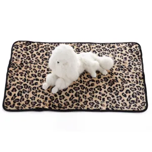 Leopard print pet blanket with white plush dog toy, soft fleece mat for cats and dogs, cozy.