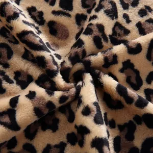 Detailed view of soft leopard print fleece fabric, perfect for cozy pet blankets and rugs.