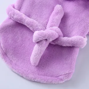 Detail shot of purple plush pet bathrobe with soft fuzzy texture and tied belt.