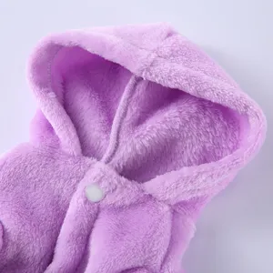 Detail of a soft purple fleece pet bathrobe with a cozy hood and white snap button.