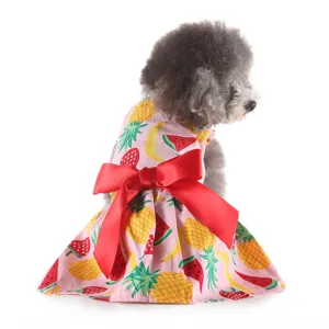 Cute summer pet dog dress with colorful fruit print and big red bow, breathable outfit.