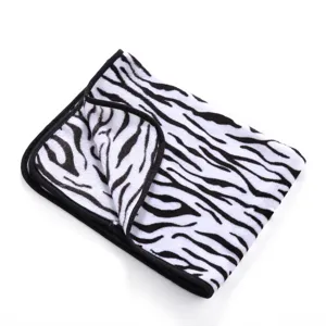 Soft double-sided fleece pet blanket detail showing classic black and white zebra pattern.