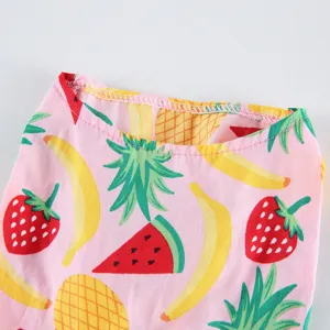 Detailed close-up of pet summer clothes with cute fruit print and neat collar stitching.