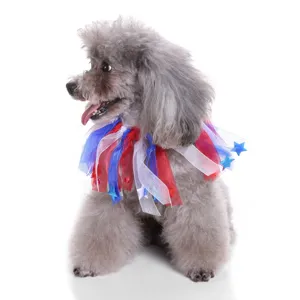 Detailed view of a festive red, white, and blue star ribbon pet collar on a grey poodle