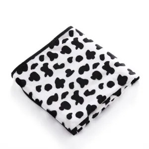 Soft double-sided fleece pet blanket detail, cozy black and white pattern for cats and dogs.