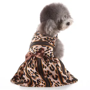Cute leopard print dog dress detail shot showcasing soft fabric and elegant brown satin bow.