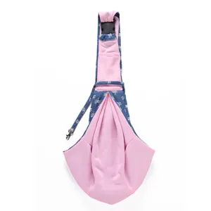 Detailed view of the breathable pet sling carrier bag with pink inner lining and palm tree pattern.