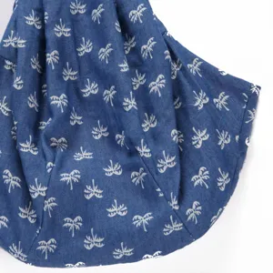 Breathable pet bag detail shot featuring a stylish blue fabric with white palm tree print.