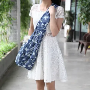 Blue camouflage pet sling carrier detail, breathable puppy bag for outdoor travel use.