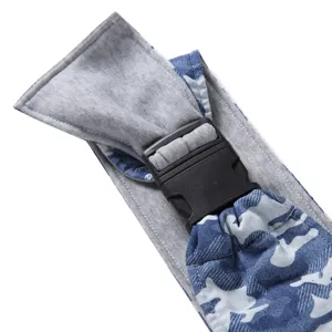 Close-up detail of breathable pet carrier backpack strap with blue camo and sturdy buckle.