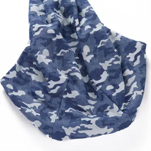 Close-up view of the blue camouflage pet sling bag, showing soft fabric texture details.