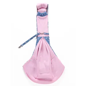 Breathable pink and denim pet sling carrier detail, comfortable puppy out bag with metal buckles.