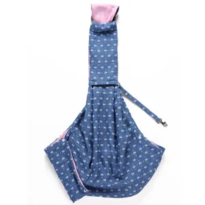 Detail shot of breathable pet sling bag with cute bow pattern and pink lining for small dogs.