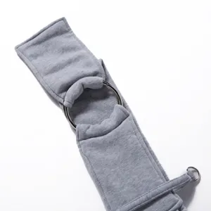 Close-up detail of breathable gray pet sling carrier featuring secure metal rings and soft fabric.