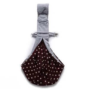 Breathable pet sling bag detail view, polka dot design with secure metal ring and adjustable strap.