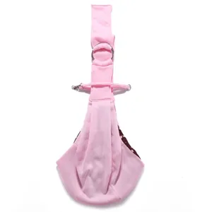 Pink breathable pet sling carrier bag with metal rings and polka dot lining detail for small dogs.