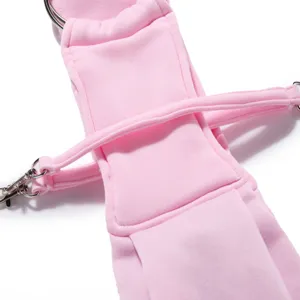 Pink pet bag strap detail showcasing durable metal hardware and breathable fabric design.