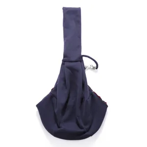 Detail view of the dark blue pet sling bag, showing soft fabric and ergonomic design.